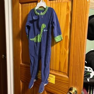 Boy’s blue and green onesie pajamas size 12 months by Carter’s.